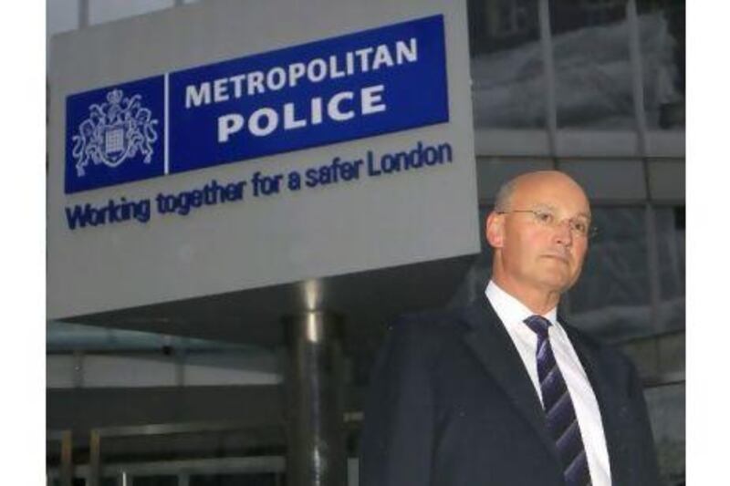 Metropolitan Police commissioner Sir Paul Stephenson leaving New Scotland Yard on Sunday. London's police chief has quit over his links to a former News of the World editor caught up in the phone hacking scandal. Sang Tan / AP Photo
