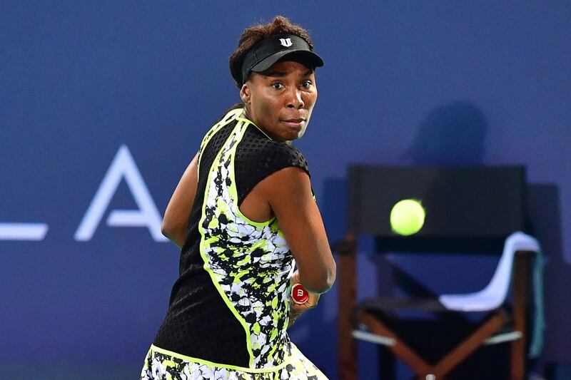 Venus Williams of the US plays the ball to Serena Williams of the US, during the 2018 Mubadala World Tennis Championship match in Abu Dhabi, on December 27, 2018.  / AFP / GIUSEPPE CACACE
