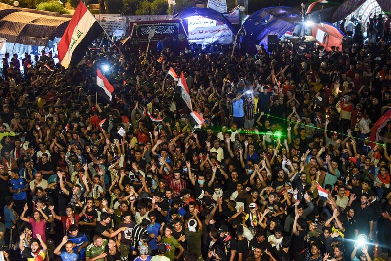Iraqi protesters gather during a late anti-government demonstration in Nasiriyah, the capital of the southern province of Dhi Qar.  AFP