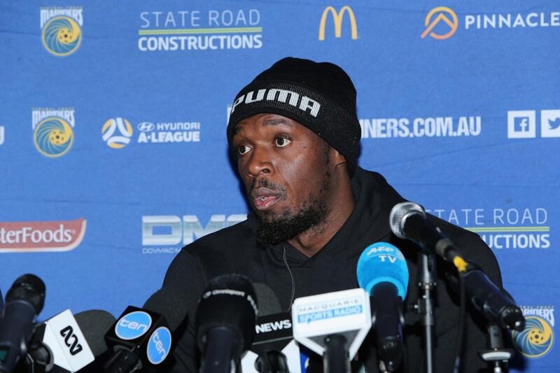 Usain Bolt speaks at the press conference after his first training session. Getty Images