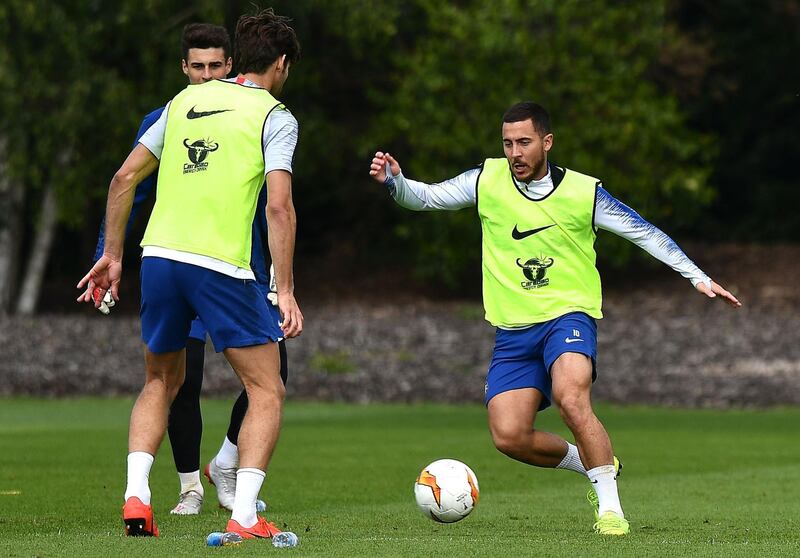 Chelsea's Belgian midfielder Eden Hazard, right, takes part in a training session. AFP