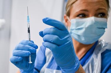 A nurse prepares a shot of the Pfizer/BioNTech vaccine on Tuesday. AP