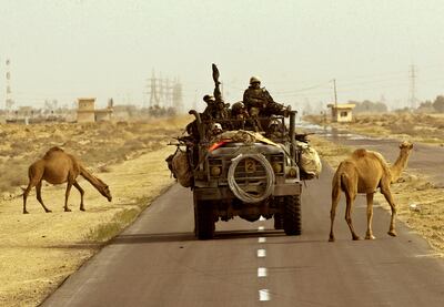 US Marines make their way from the port of Umm-Qasr in southern Iraq to town of Az-Zubair, south of Basra. Reuters