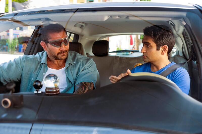 This image released by 20th Century Fox shows Dave Bautista, left, and Kumail Nanjiani in a scene from "Stuber." (Mark Hill/20th Century Fox via AP)
