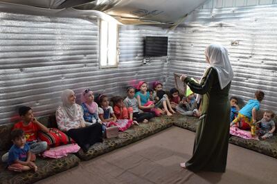 Reading session in refugee camp (courtesy of WLR)