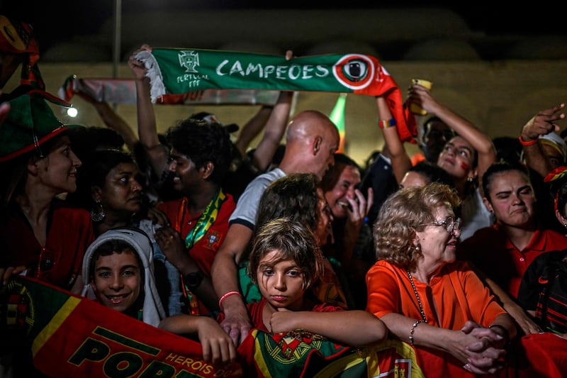 Portugal's supporters cheer as the team arrives at their hotel in Al Shamal. AFP