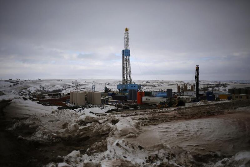 Above, an oil derrick at a fracking site in North Dakota. Shannon Stapleton / Reuters