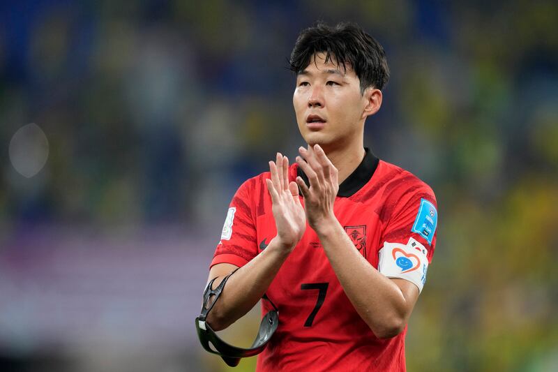 Son Heung-min applauds the fans after South Korea's defeat to Brazil in the World Cup last 16. AP