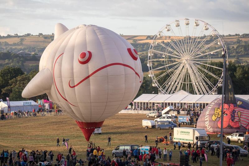 A tethered balloon inflates during a ground tether flight after bad weather prevented flying in the planned mass sun rise ascent at the Bristol International Balloon Fiesta. Getty Images