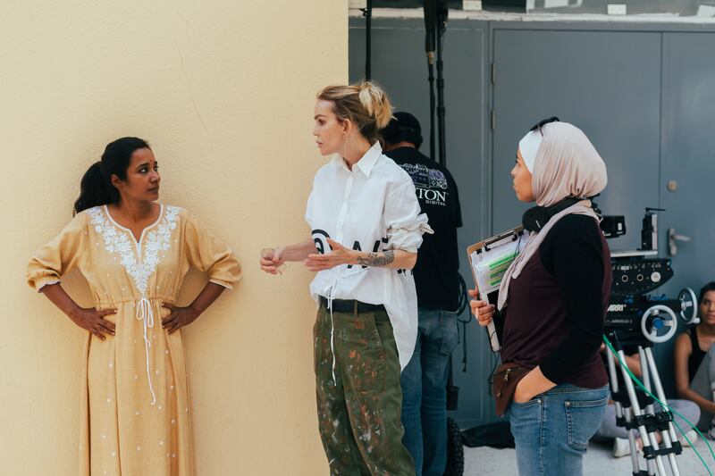Director Wendy Bednarz, centre, with lead actress Tannishtha Chaterjee on the set of Yellow Bus. Photo: OSN