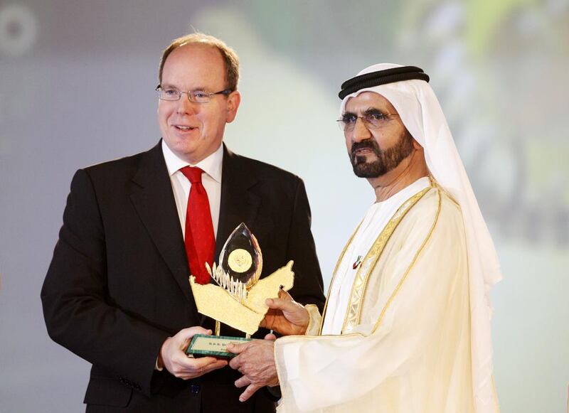 Sheikh Mohammed bin Rashid, Vice President and Ruler of Dubai, presents Prince Albert II of Monaco an award for his global leadership in environmental and sustainable development during the Zayed International Prize for the Environment at the Grand Hyatt Hotel in Dubai on May 7, 2014. Christopher Pike / The National

