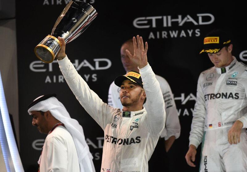 Lewis Hamilton salutes the crowd after winning the Abu Dhabi Grand Prix, although his victory was not enough for him to retain his drivers' championship title. Mohammad Al Shaikh / AFP

