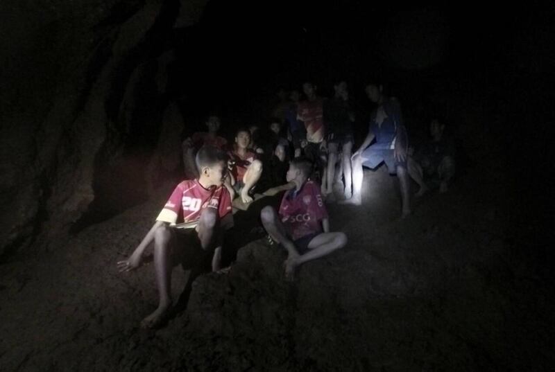 epaselect epa06859102 An undated handout photo released by Royal Thai Army on 03 July 2018 shows the missing 13 young members of a youth soccer team including their coach, moments they were found inside the cave complex at Tham Luang cave in Khun Nam Nang Non Forest Park, Chiang Rai province, Thailand. Chiang Rai provincial Governor Narongsak Osatanakorn said on 02 July that all of 13 young members of a youth soccer team including their coach have been  found alive in the cave.  EPA/ROYAL THAI ARMY HANDOUT  HANDOUT EDITORIAL USE ONLY/NO SALES