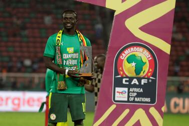 Senegal's Sadio Mane poses with Player of the Tournament awards after the African Cup of Nations 2022 final soccer match against Egypt at the Olembe stadium in Yaounde, Cameroon, Sunday, Feb.  6, 2022.  (AP Photo / Themba Hadebe)