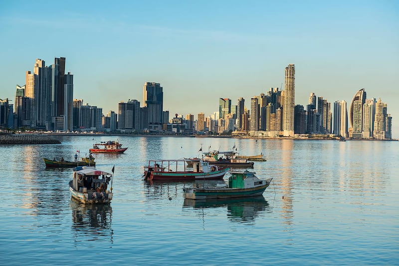 Fishing boats and the skyline of Panama City, Panama, another country on the red list.