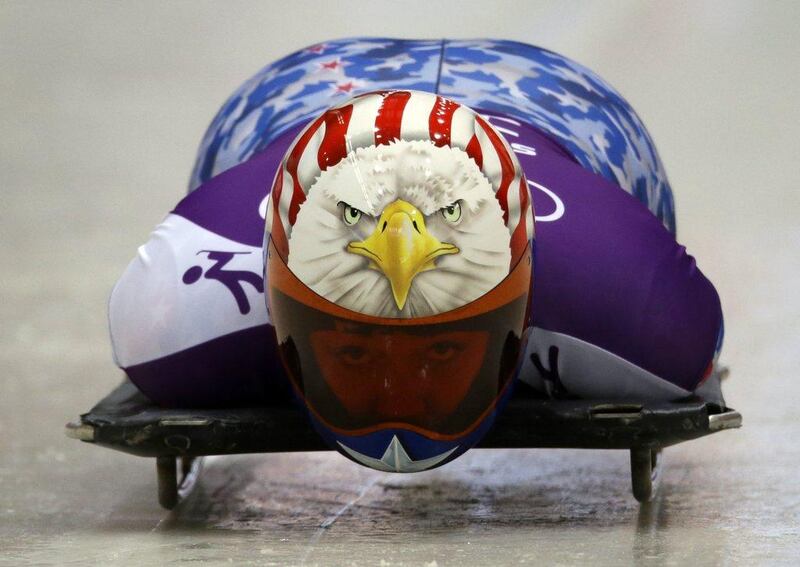 American Katie Uhlaender dons a patriotic stars-and-stripes, bald-eagle themed helmet. Dita Alangkara / AP