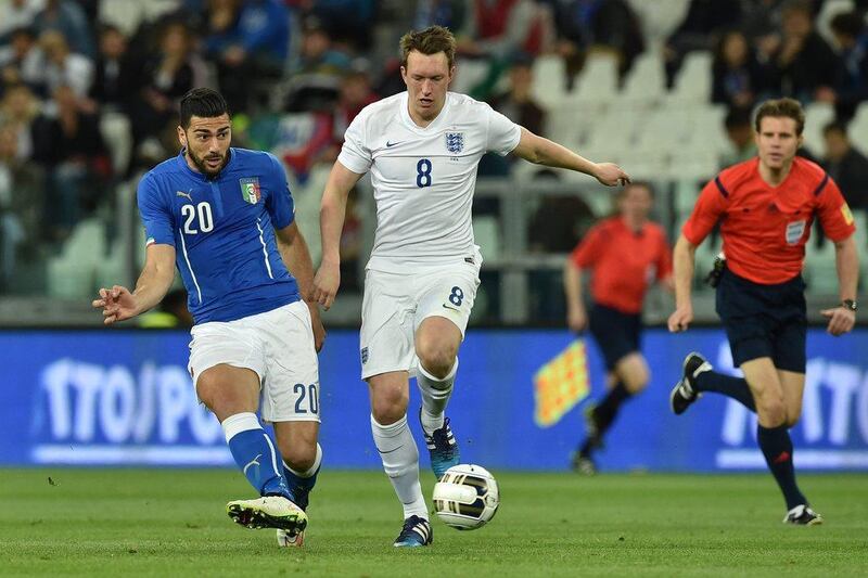 Graziano Pelle, left, of Italy in action against Phil Jones of England during their international friendly match at the Juventus Arena on March 31, 2015 in Turin, Italy. (Photo by Valerio Pennicino/Getty Images)