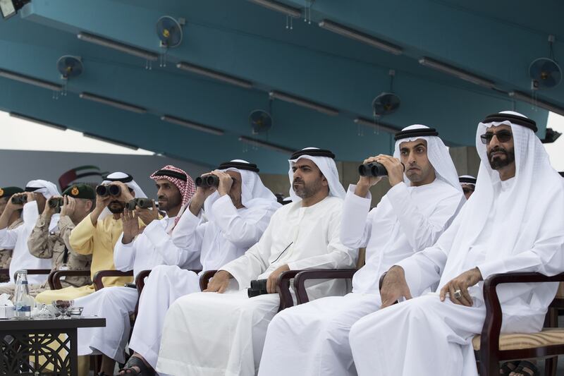 From right: Mohamed Ahmad Al Bowardi, Minister of State for Defence Affairs, Sheikh Khaled bin Zayed, Chairman of the Board of Zayed Higher Organisation for Humanitarian Care and Special Needs, Sheikh Hamed bin Zayed, Chairman of the Crown Prince Court of Abu Dhabi, Sheikh Saif bin Zayed, Deputy Prime Minister and Minister of Interior, Sheikh Nahyan bin Zayed, Chairman of the Board of Trustees of Zayed bin Sultan Al Nahyan Charitable and Humanitarian Foundation, and Sheikh Hamdan bin Zayed, Ruler’s Representative in the Western Region of Abu Dhabi, watch the the Armed Forces put on a show. Ryan Carter / Crown Prince Court - Abu Dhabi