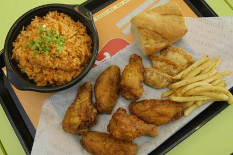 The crispy wings combo with kimchi fried rice at Bon Chon Chicken in Dubai.