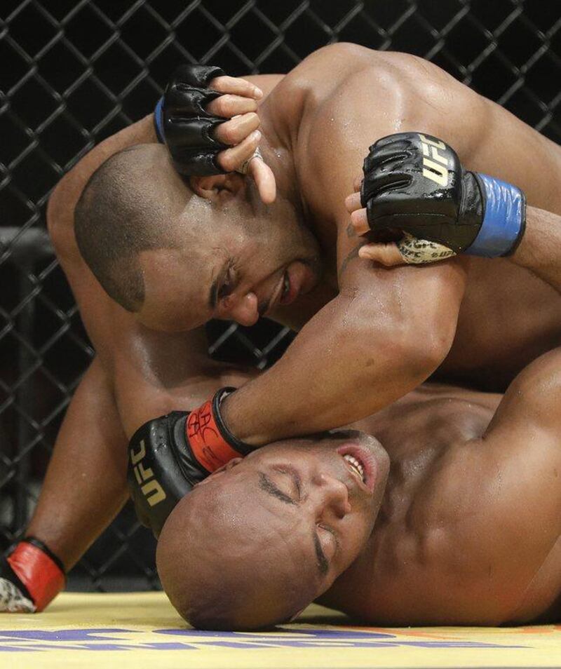 Daniel Cormier, top, pressure Anderson Silva during their light heavyweight bout at UFC 200, Saturday, July 9, 2016, in Las Vegas. John Locher / AP Photo