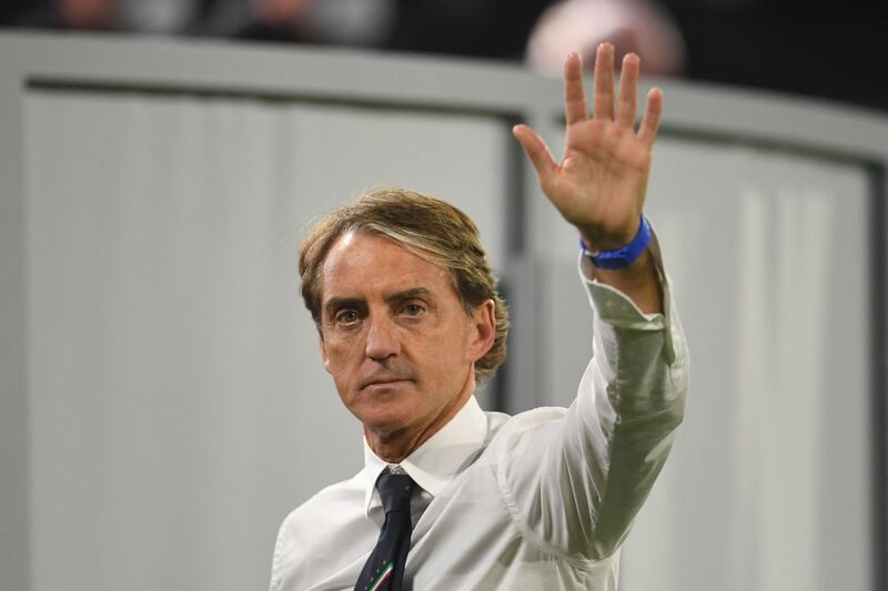 Italy's coach Roberto Mancini waves at the end of the match.