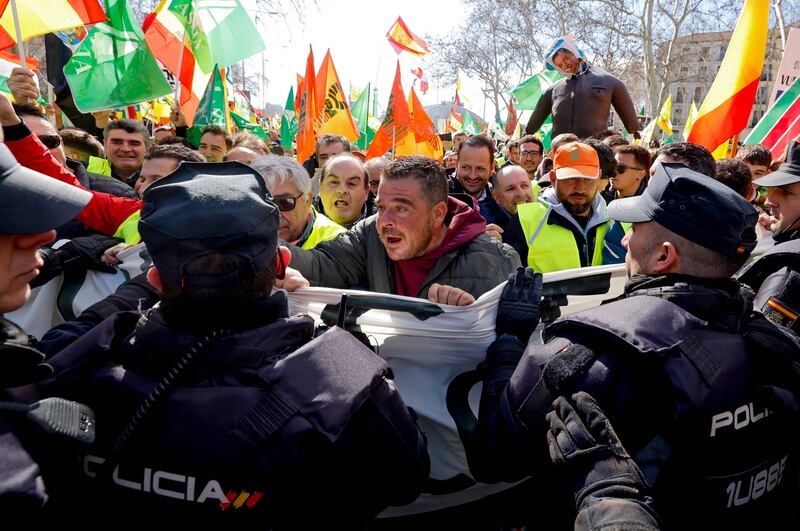Farmers and police officers clash in Madrid at a protest against European agricultural policy. AFP