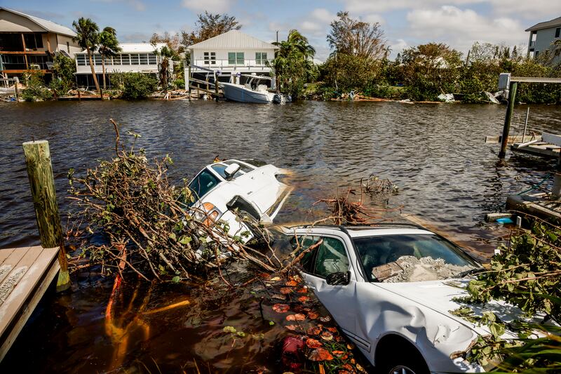 Cars submerged in a canal in the wake of Hurricane Ian. EPA