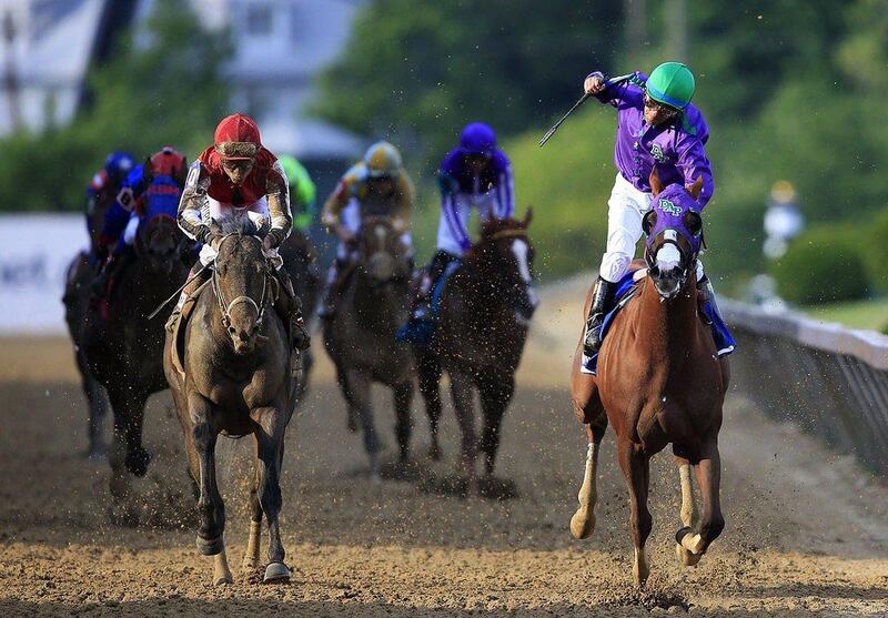 California Chrome gallops to victory in the 139th Preakness Stakes on Saturday. Rob Carr / Getty Images / AFP / May 17, 2014