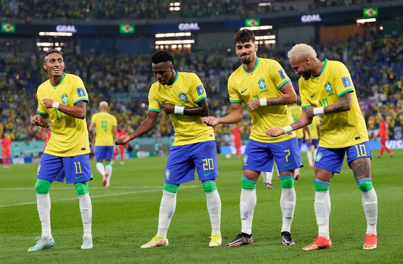 Vinicius Junior, second left, celebrates with Raphinha, Lucas Paqueta and Neymar after scoring Brazil's opening goal in their World Cup last-16 win over South Korea at the Stadium 974 in Doha, on December 5, 2022. AP