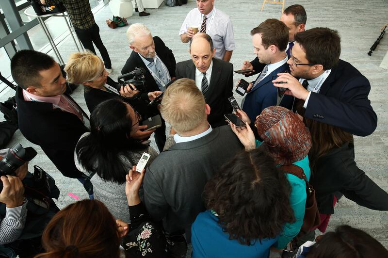 Akbar Al Baker, chief executive officer of Qatar Airways, center, speaks to members of the media at the International Air Transport Association (IATA) annual general meeting in Sydney, Australia, on Tuesday, June 5, 2018. Qatar Airways, which has ordered 50 Airbus SE's A321 aircraft, doesn't need the planes until 2020, Al Baker said, signaling he's ready to take delivery a year later than originally planned as production delays plague the engine makers. Photographer: Brendon Thorne/Bloomberg