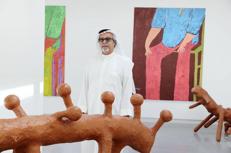 SHARJAH , UNITED ARAB EMIRATES , MARCH 15  – 2017 :- Mohamed Ahmed Ibrahim , artist with his work during the opening of the exhibition at Sharjah Art Foundation in Sharjah. ( Pawan Singh / The National ) For Arts & Life. Story by Melissa