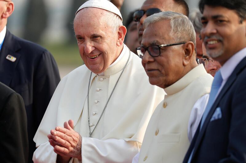 Pope Francis is accompanied by Bangladesh's President Abdul Hamid after arriving to Dhaka. Damir Sagolj / Reuters