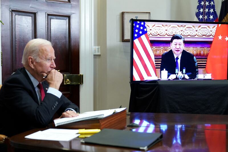 US President Joe Biden meets China's President Xi Jinping during a virtual summit this month. AFP