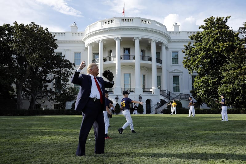 US President Donald Trump throws a baseball on the South Lawn of the White House on Thursday. Bloomberg
