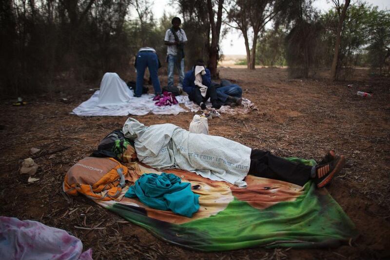 The Africans say they are fleeing persecution and danger. Israel says many are looking for employment. Menahem Kahana/AFP Photo