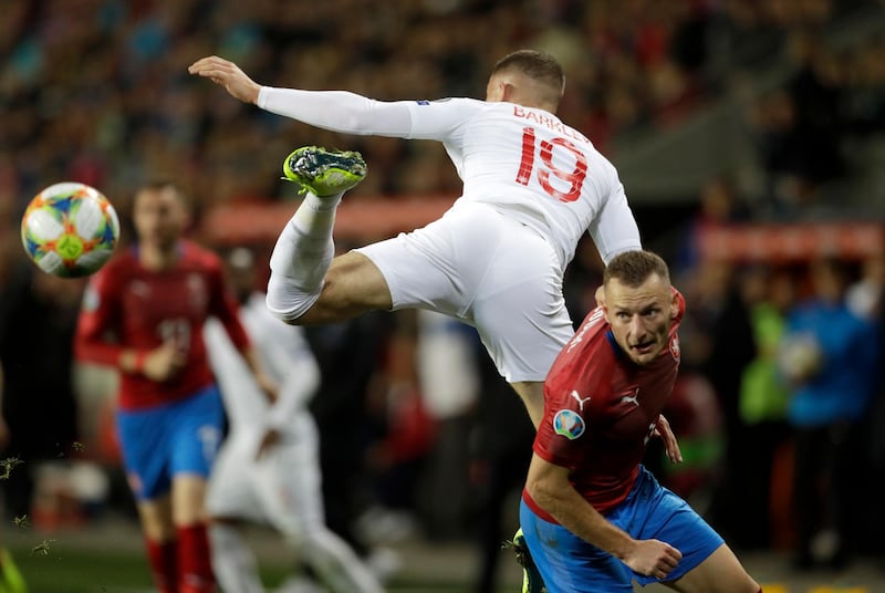 Czech Republic's Vladimir Coufal, right, duels for the ball with England's Ross Barkley during the Euro 2020 group A qualifying soccer match between Czech Republic and England at the Sinobo stadium in Prague, Czech Republic. AP Photo
