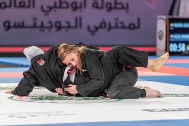 Mary Jones, right, on her way to gold medal success on the first day of the Abu Dhabi World Professional Jiu-Jitsu Championship. Antonie Robertson / The National 