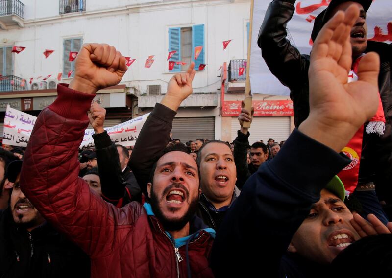 Men shout slogans during demonstrations on the seventh anniversary of the toppling of president Zine El-Abidine Ben Ali, in Tunis, Tunisia January 14, 2018. REUTERS/Youssef Boudlal