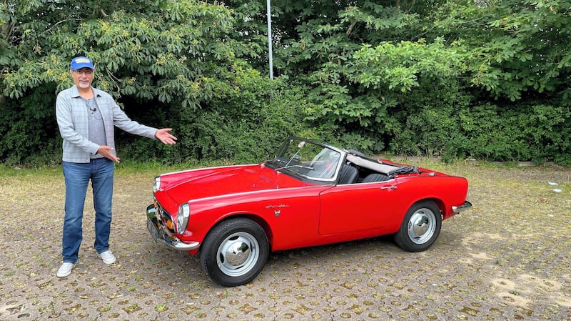 Shahzad Sheikh, who reviewed the Honda S800 for 'The National', towers over the car, but was able to fit in relatively comfortably