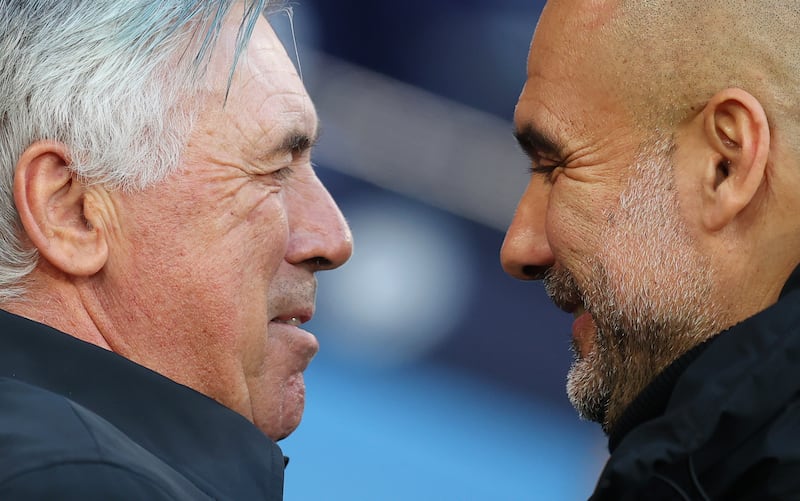 Real Madrid coach Carlo Ancelotti and City's Pep Guardiola greet each other before kick-off. Getty