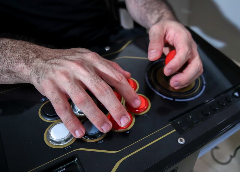 His game controller of choice for competitions is an arcade joystick and buttons, which he can use to deploy lethal combos on his opponents