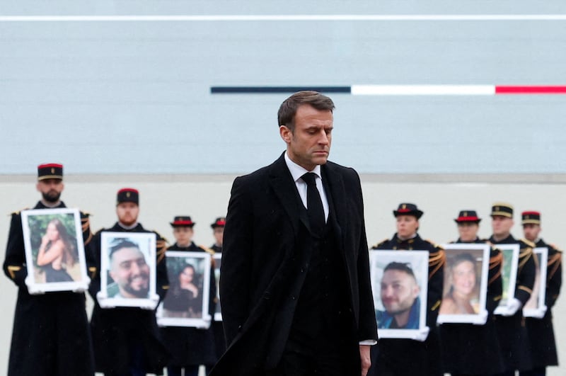 President Macron at the ceremony, which took place four months after the attacks. AFP