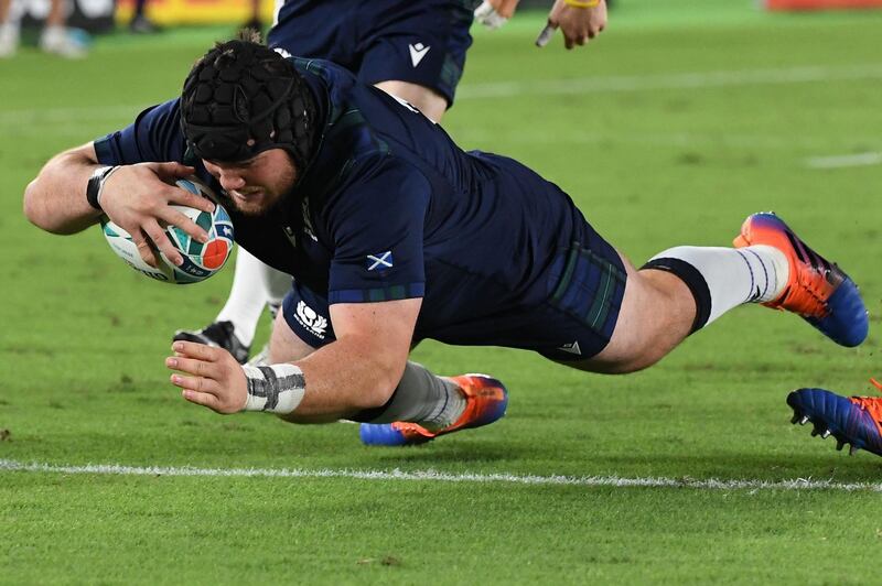 Scotland prop Zander Fagerson scores his team's third try against Japan. AFP