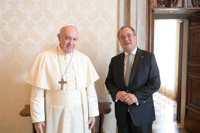 Pope Francis and Germany's Armin Laschet, federal state premier of North Rhine-Westphalia, pose for a picture as they meet at the Vatican October 1, 2020.   Vatican Media/­Handout via REUTERS    ATTENTION EDITORS - THIS IMAGE WAS PROVIDED BY A THIRD PARTY.