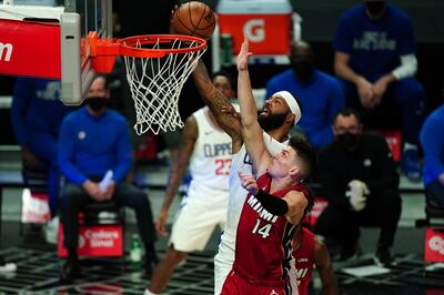 Feb 15, 2021; Los Angeles, California, USA; LA Clippers forward Marcus Morris Sr. (8) shoots the ball over Miami Heat guard Tyler Herro (14) in the first half at Staples Center. Mandatory Credit: Kirby Lee-USA TODAY Sports