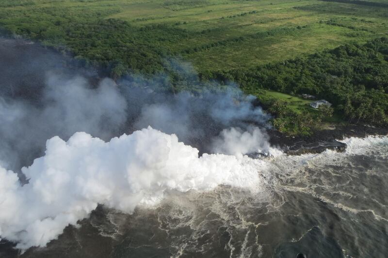 Lava entering the ocean near Pahoa, Hawaii. The ongoing eruption of Kilauea is the largest in decades, destroying more than 40 homes to date, and displacing thousands. USGS / EPA