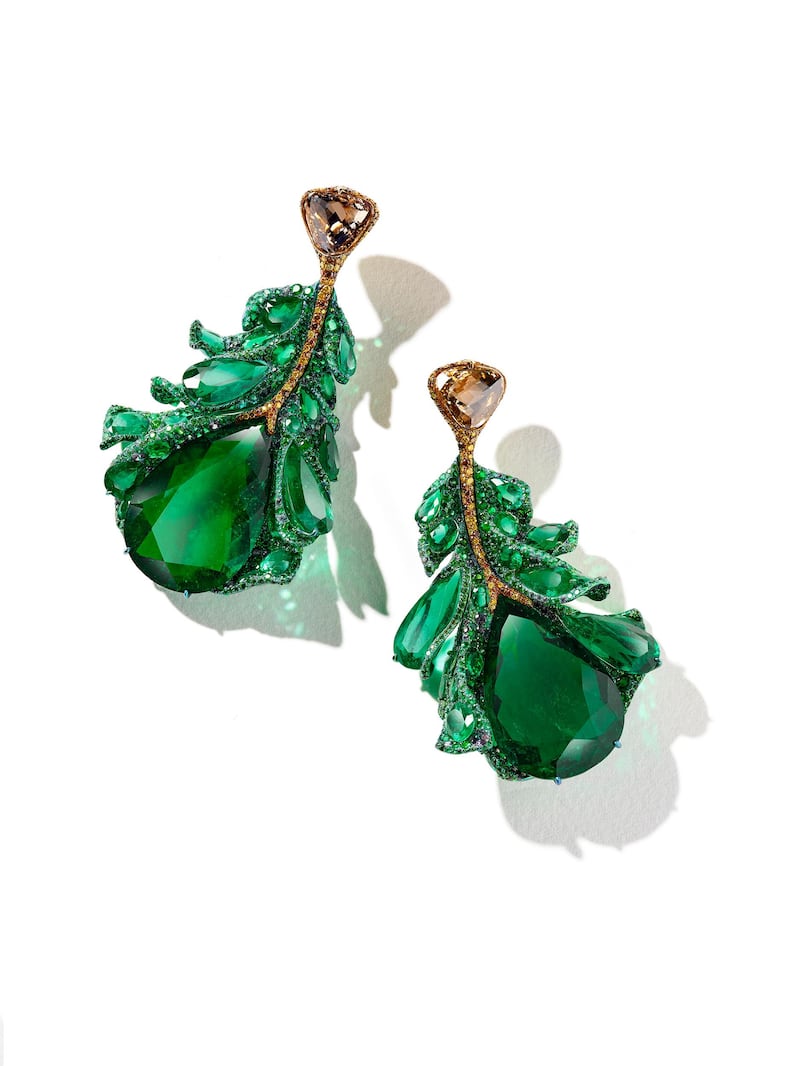 Green Plumule Earrings: The matching earrings feature two large Colombian emeralds, as well as two briolette-cut brown diamonds.