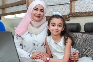 Dr Abeer Darwish and her daughters Rand (pictured) and Raghad have received full scholarships under the Hayyakum initiative. Victor Besa / The National 