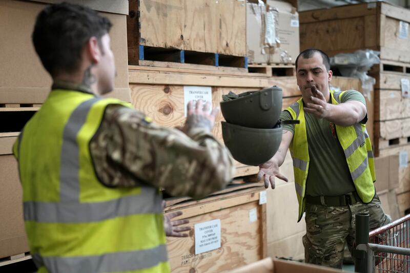 On Thursday, soldiers from from 2nd Battalion, The Royal Anglian Regiment, sorted and packed some of the surplus 84,000 ballistic helmets being shipped from Donnington to soldiers and emergency service workers in Ukraine. Getty Images
