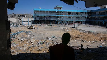 Displaced Palestinians in the remains of a United Nations Relief and Works Agency (UNRWA) school in central Khan Younis, Gaza, on Tuesday, May 7, 2024.  International negotiators, including from the US, are at a delicate phase in talks to pause or end the seven-month war — a deal that would include the exchange of hostages for Palestinian prisoners and an increase of humanitarian aid to the embattled coastal strip.  Photographer: Ahmad Salem / Bloomberg